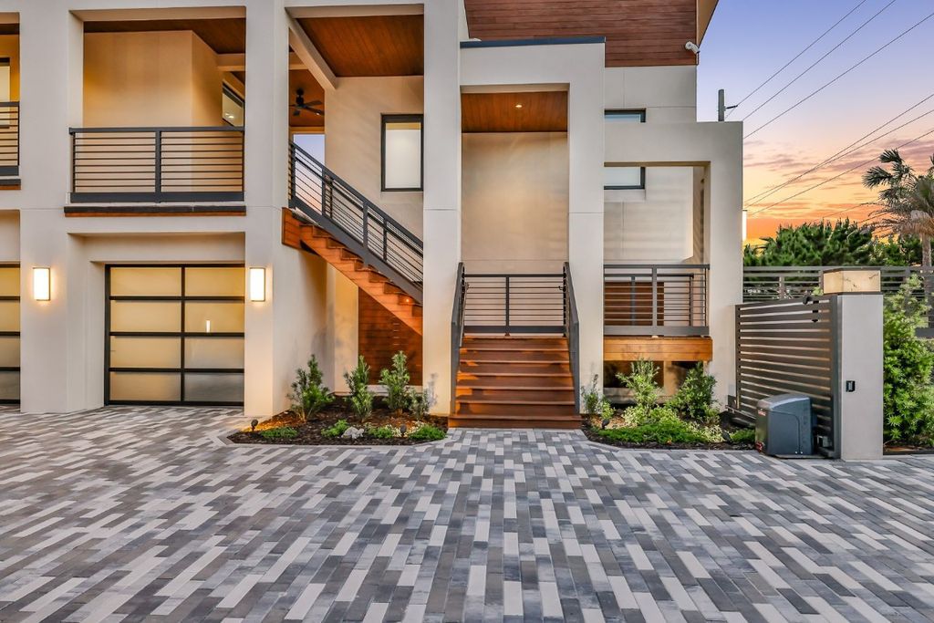 Immerse yourself in unparalleled luxury at this beachfront masterpiece on Amelia Island. This 6 bed, 8 bath custom estate boasts John Cotner design, commercial-grade construction, chef's kitchen, infinity pool and spa, and private guest house. Experience the epitome of coastal living.