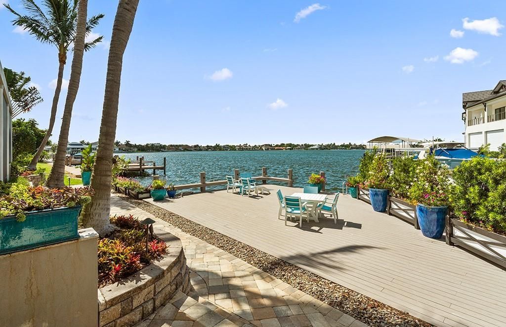 Never-before-listed masterpiece! This 7,100+ square feet estate boasts waterfront views, infinity pool, gourmet kitchen, and more! Perfect for entertaining with multiple living areas and a bonus room. Must-see in South Florida!