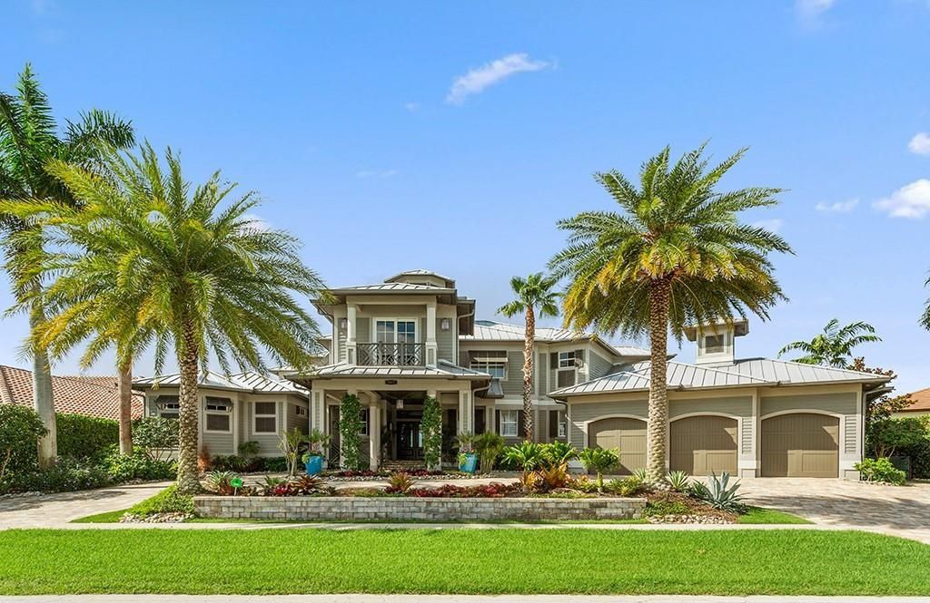 Never-before-listed masterpiece! This 7,100+ square feet estate boasts waterfront views, infinity pool, gourmet kitchen, and more! Perfect for entertaining with multiple living areas and a bonus room. Must-see in South Florida!