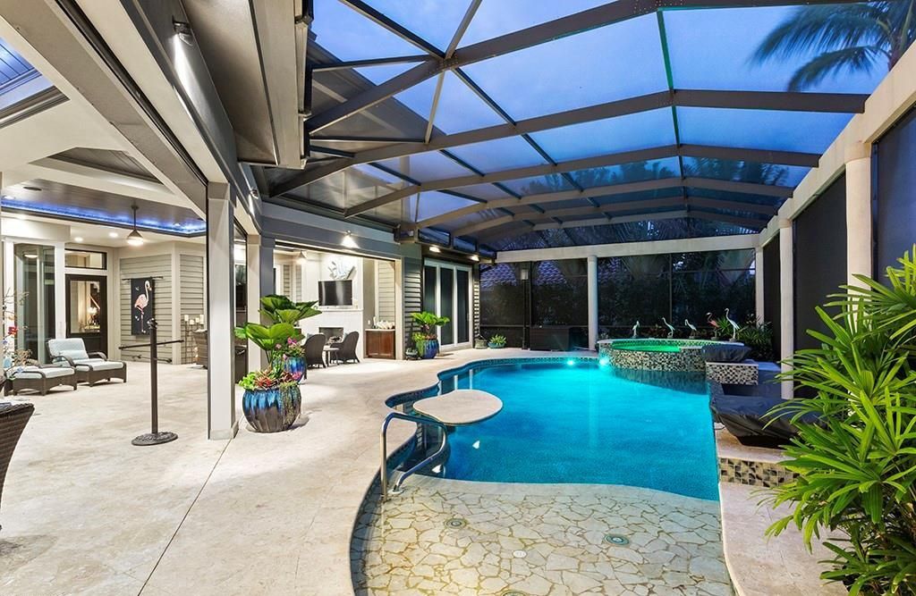 Never-before-listed masterpiece! This 7,100+ square feet estate boasts waterfront views, infinity pool, gourmet kitchen, and more! Perfect for entertaining with multiple living areas and a bonus room. Must-see in South Florida!