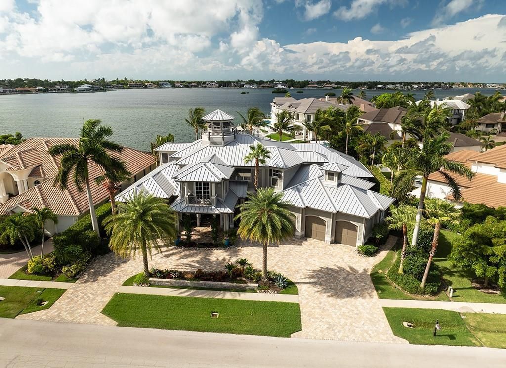 Never-before-listed masterpiece! This 7,100+ square feet estate boasts waterfront views, infinity pool, gourmet kitchen, and more! Perfect for entertaining with multiple living areas and a bonus room. Must-see in South Florida!