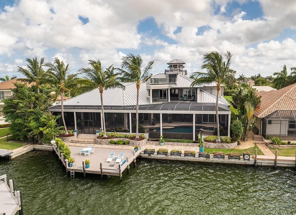 Never-before-listed masterpiece! This 7,100+ square feet estate boasts waterfront views, infinity pool, gourmet kitchen, and more! Perfect for entertaining with multiple living areas and a bonus room. Must-see in South Florida!