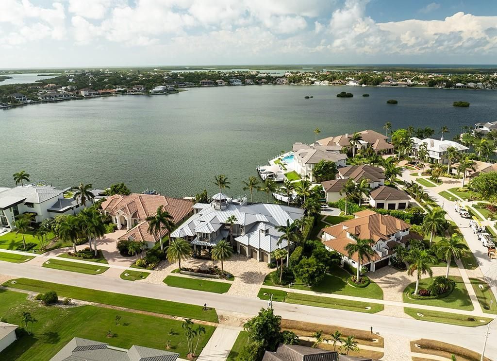 Never-before-listed masterpiece! This 7,100+ square feet estate boasts waterfront views, infinity pool, gourmet kitchen, and more! Perfect for entertaining with multiple living areas and a bonus room. Must-see in South Florida!