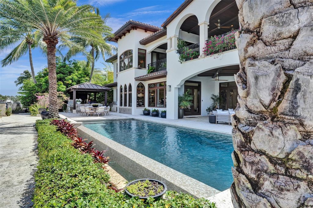 Wake up to stunning water views in this Fort Lauderdale dream home! This 6-bedroom estate offers an infinity pool, dock, and direct ocean access. Live the Florida dream!