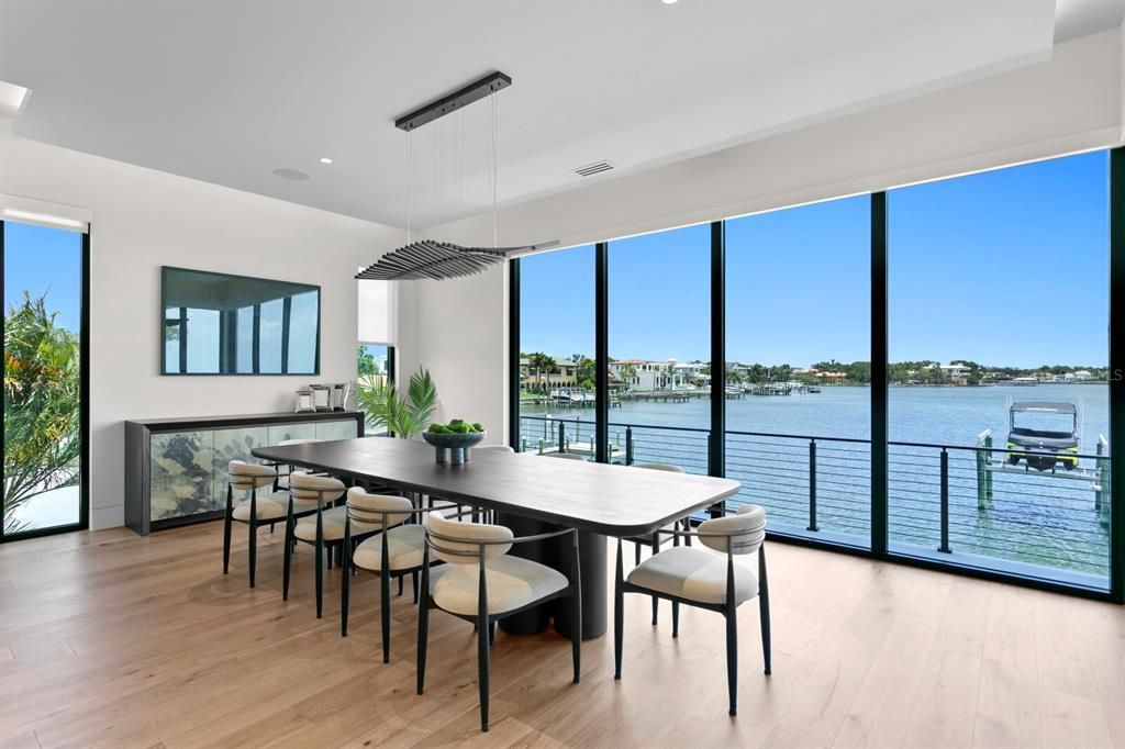 Rarely available NEW CONSTRUCTION! Live the dream in this 6-bedroom, 5.5-bath bayfront masterpiece. Sweeping water views, infinity pool, custom finishes, movie theater, wine cellar, and more in a sought-after school district. Available furnished.