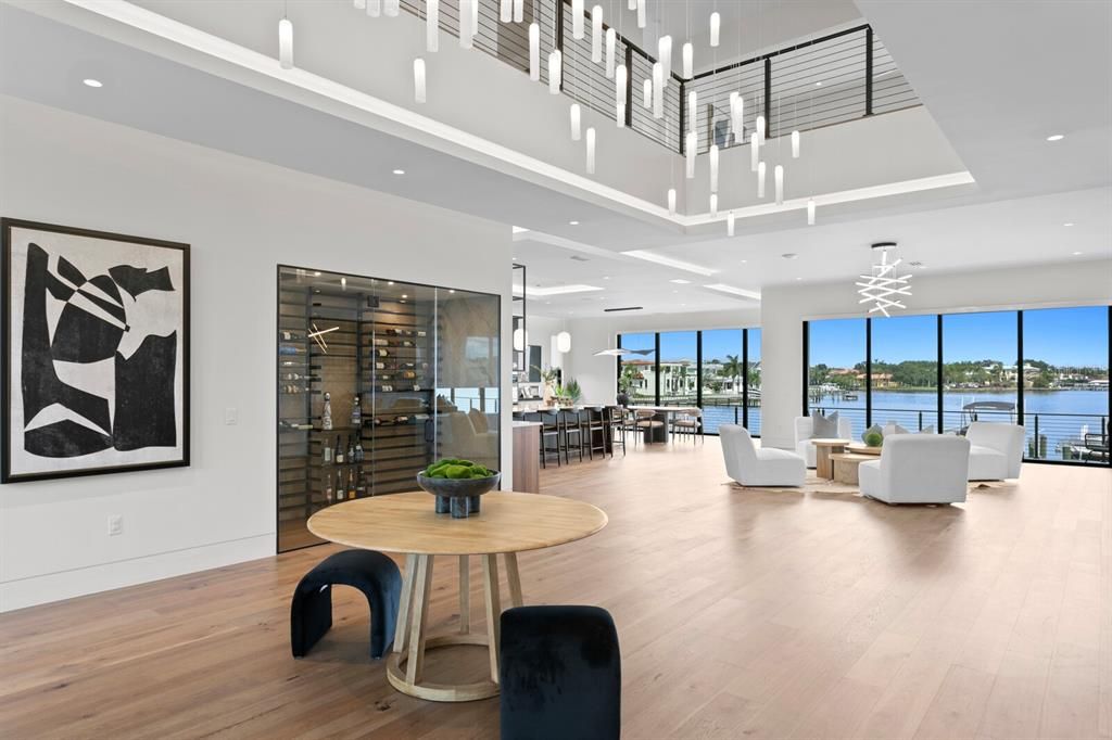 Rarely available NEW CONSTRUCTION! Live the dream in this 6-bedroom, 5.5-bath bayfront masterpiece. Sweeping water views, infinity pool, custom finishes, movie theater, wine cellar, and more in a sought-after school district. Available furnished.