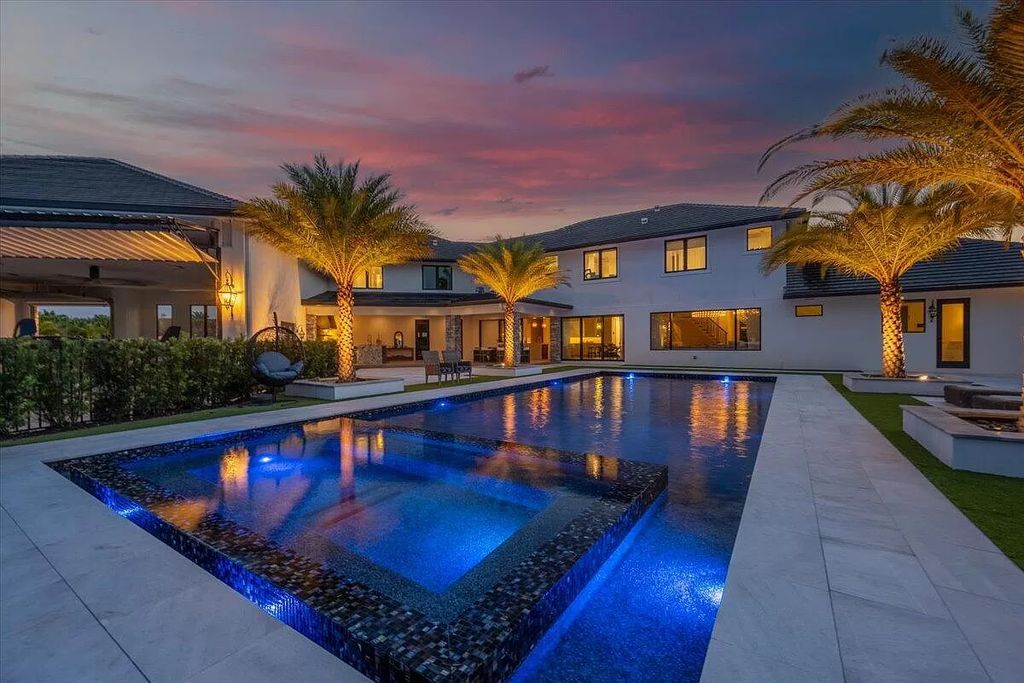 Experience unparalleled luxury in Wellington's finest aviation estate. Featuring a private hangar, resort-style pool, chef's kitchens, and home automation, this 7-bed, 8.5-bath estate redefines "dream home."