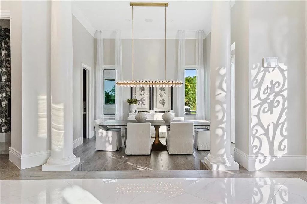 Experience unparalleled luxury in Wellington's finest aviation estate. Featuring a private hangar, resort-style pool, chef's kitchens, and home automation, this 7-bed, 8.5-bath estate redefines "dream home."