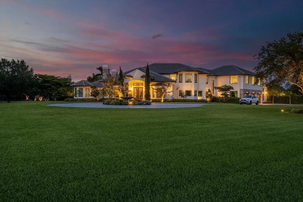 Experience unparalleled luxury in Wellington's finest aviation estate. Featuring a private hangar, resort-style pool, chef's kitchens, and home automation, this 7-bed, 8.5-bath estate redefines "dream home."